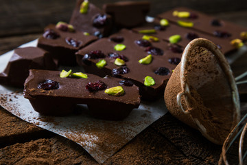 Homemade chocolate with dried berries and pistachios