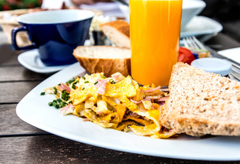 Breakfast with orange juice and fresh fruits on table