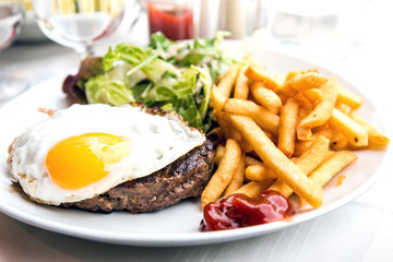 Egg and fries - classical english breakfast with egg and fries