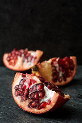 Pomegranate fruit on slate background

