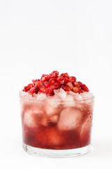 Red cocktail with pomegranate and ice isolated on white background

