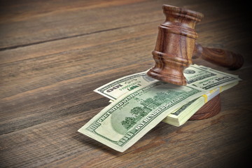 Judges or Auctioneer Gavel And Dollars Cash On  Wooden Table