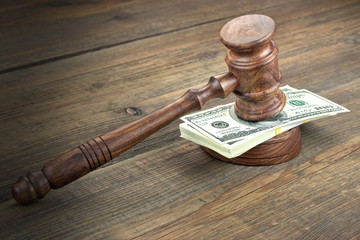 Judges or Auctioneer Gavel And Dollars Cash On  Wooden Table