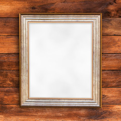 Blank of photo frame on wood wall background.