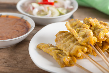 Grilled pork satay with peanut sauce and sour sauce. Selective f