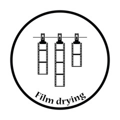 Icon of photo film drying on rope with clothespin