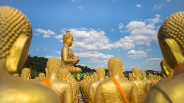 Time lapse Buddha statue with cloud flowing
