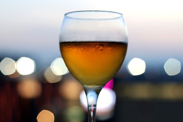 Cold beer in a glass. Selective focus with beautiful bokeh.