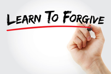 Hand writing Learn To Forgive with marker, concept background