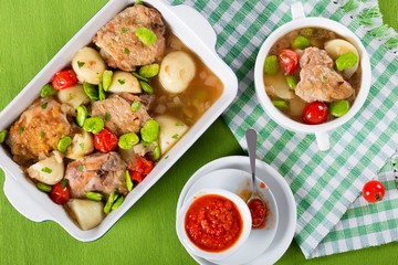 oven baked chicken things with vegetables. top view