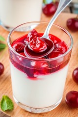 homemade dessert panna cotta with cherry and mint