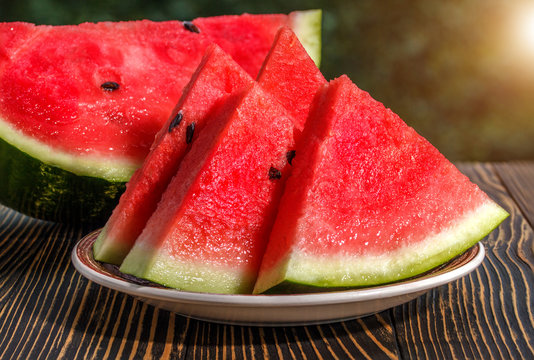 Fresh sliced watermelon wooden background