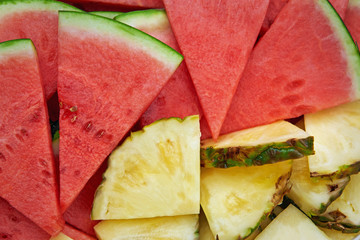 Sliced pineapple and watermelon