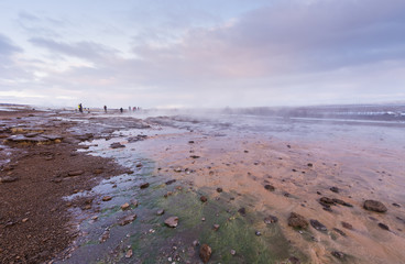 The colorful geyser landscape at the Haukadalur geothermal area, part of the golden circle route, in Iceland