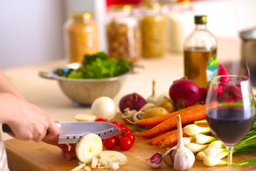 Young Woman Cooking in the kitchen. Healthy Food