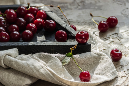 cherries on wooden plate