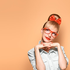 Fashion. Woman in Stylish Glasses Having Fun. Hipster fashion girl think, idea. Playful nerd Blonde...