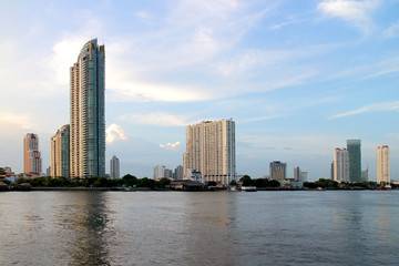 Bangkok pier riverside Thailand, view high building tower, condominium and hotel.