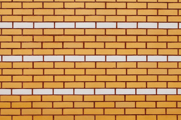 wall of yellow and white ceramic brick.