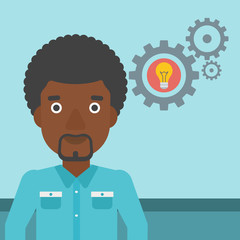 Man with business idea bulb in gear.