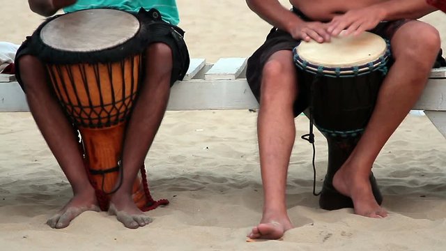 man playing on drum 