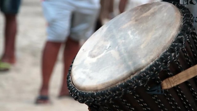 man playing on drum 