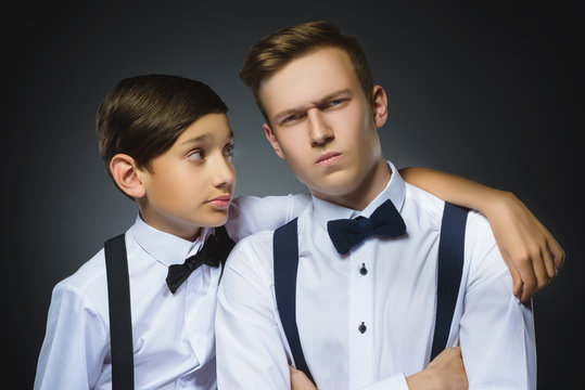 boy looks questioningly at disaffected teenager or brother