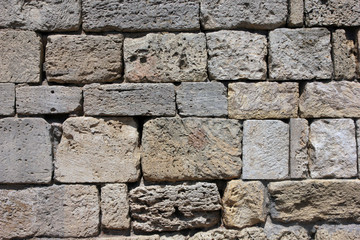 Obraz premium texture of old dilapidated shabby sandstone masonry of square sa
