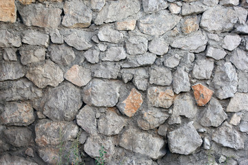 stone masonry wall from old dilapidated shabby rubble foreground