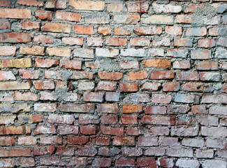 texture of old dilapidated shabby red brick masonry of red brick