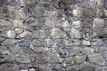 stone masonry wall from old dilapidated shabby rubble from big l