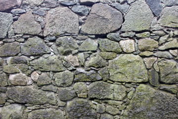 stone masonry wall from old dilapidated shabby rubble from big l