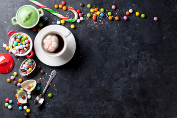 Colorful candies and coffee cup