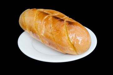 Garlic and herb bread isolated on the black background with clip