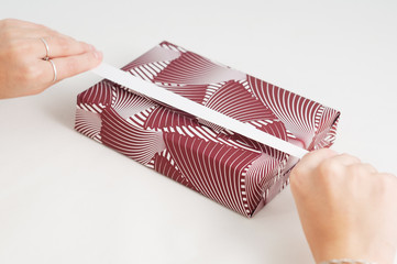 Decorated paper wrap handmade book gift craft ribbon stripe manual directions isolated