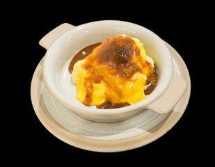 Mashed potatoes with cheese isolated on the black background wit