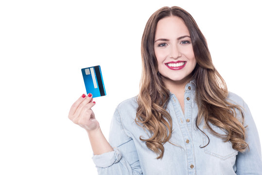 Delightful female model showing debit card.