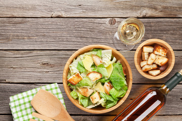 Fototapeta na wymiar Fresh healthy salad and white wine