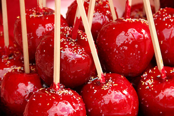 Sweet candy apples covered with colorful sprinkles