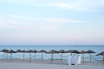 many sun umbrellas in the warm sandy beach