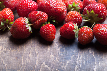Lots of fresh bright red strawberries. Selective focus. Shallow