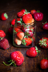 Lots of fresh bright red strawberries. Selective focus. Shallow