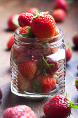 Lots of fresh bright red strawberries. Selective focus. Shallow