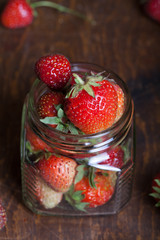 Lots of fresh bright red strawberries. Selective focus. Shallow