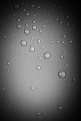 Drops of water on a color background. Gray. Toned