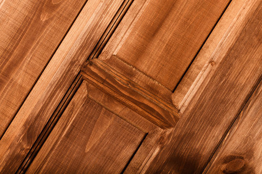 Fragment of new painted wooden door. Toned