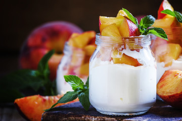 Dessert with sweet peaches, cottage cheese and whipped cream, se