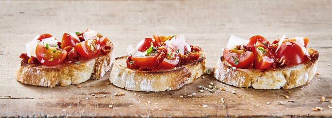 Tomato bruschetta with parmesan cheese - obrazy, fototapety, plakaty