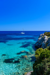 Naklejka premium Sailing boat at cala Ratjada, Mallorca - beautiful beach and coast