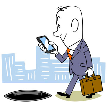 歩きスマホをするビジネスマン